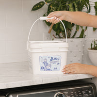 Placing 500 load bucket of laundry detergent on laundry room counter