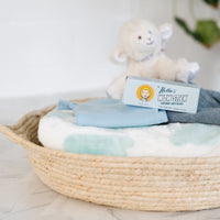 WOW Stick stain remover on a basket of baby clothes