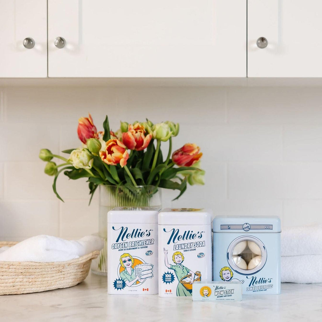 Laundry products and flowers on a counter