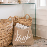 Brown jute tote bag with rope handles with blanket inside